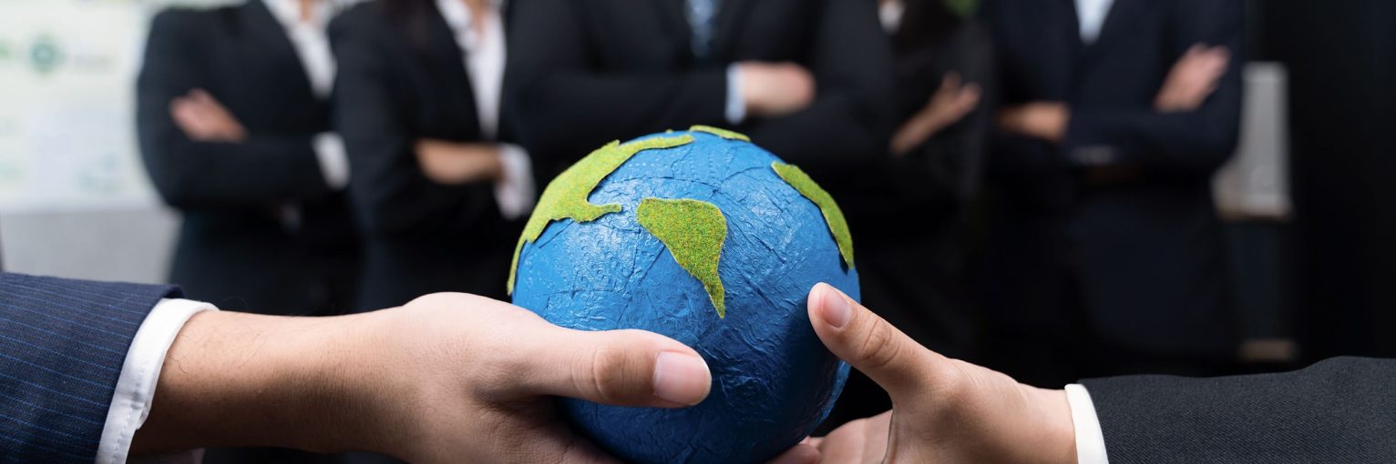 Top view business people holding Earth together in synergy as team building to utilize eco regulation for environmental protection by reducing CO2 emission to save Earth. Quaint